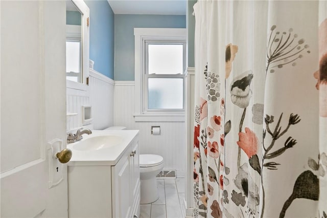 1163 Chislett, Morningside, PA 15206 - full bathroom with toilet, wainscoting, a wealth of natural light, and vanity