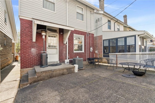 1163 Chislett, Morningside, PA 15206 - back of house featuring brick siding, central AC unit, and a patio area