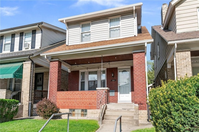 1163 Chislett, Morningside, PA 15206 - view of front facade with roof with shingles, covered porch, and brick siding