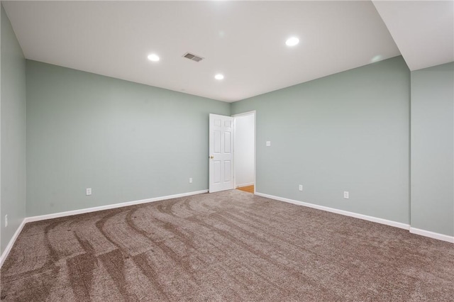 spare room with visible vents, baseboards, recessed lighting, and carpet floors
