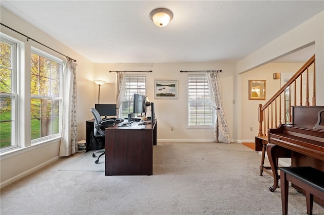 home office featuring carpet flooring and baseboards