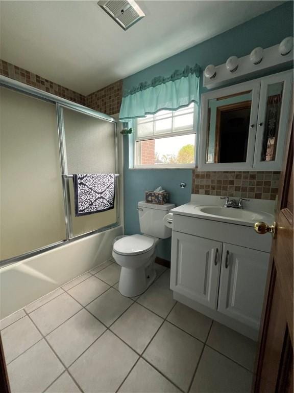 225 Jefferson Ave, Masontown, PA 15461 - bathroom with tile patterned flooring, shower / bath combination with glass door, toilet, vanity, and visible vents