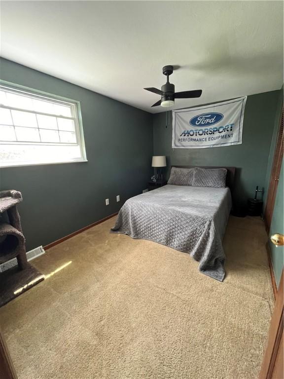 225 Jefferson Ave, Masontown, PA 15461 - carpeted bedroom featuring visible vents and a ceiling fan