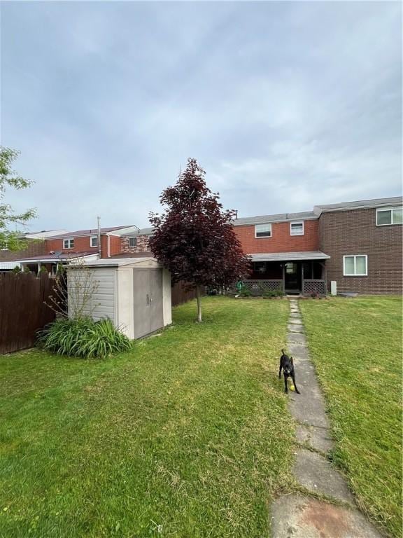 225 Jefferson Ave, Masontown, PA 15461 - view of yard with a storage unit, fence, and an outbuilding