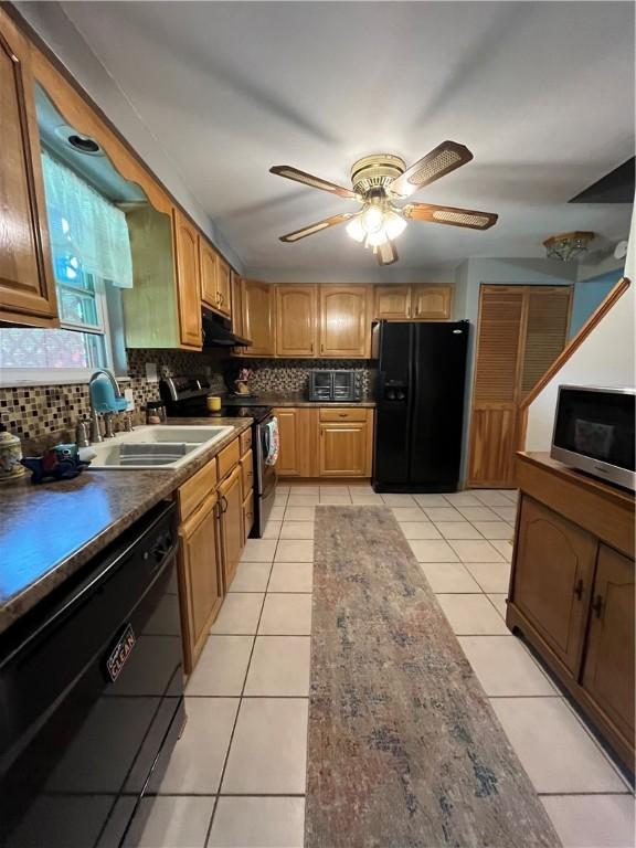 225 Jefferson Ave, Masontown, PA 15461 - kitchen featuring exhaust hood, a sink, ceiling fan, black appliances, and backsplash