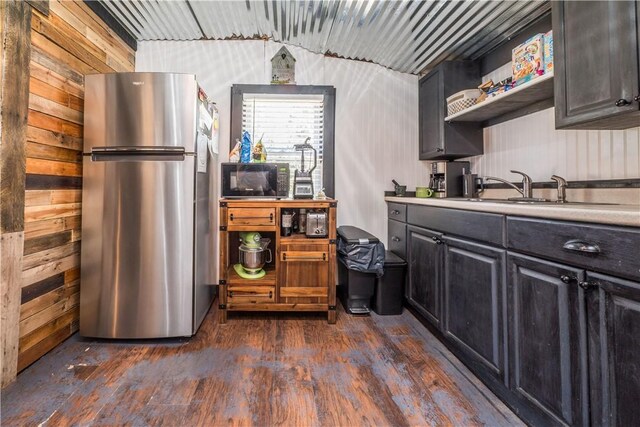 337 Whitestown Rd, Twp Of But Nw, PA 16001 - kitchen with dark wood finished floors, freestanding refrigerator, light countertops, a sink, and black microwave