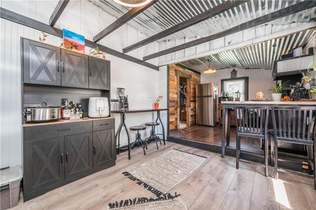 337 Whitestown Rd, Twp Of But Nw, PA 16001 - bar with a dry bar, beamed ceiling, light wood finished floors, and freestanding refrigerator