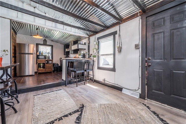 337 Whitestown Rd, Twp Of But Nw, PA 16001 - interior space featuring visible vents, vaulted ceiling with beams, and hardwood / wood-style flooring
