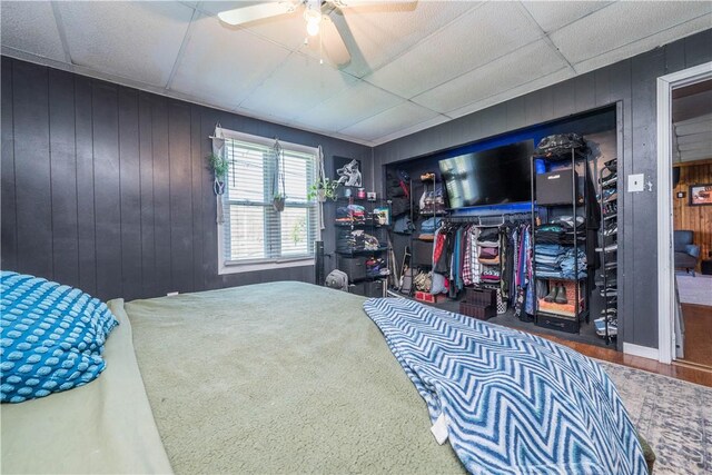 337 Whitestown Rd, Twp Of But Nw, PA 16001 - bedroom featuring wooden walls, a paneled ceiling, ceiling fan, and wood finished floors