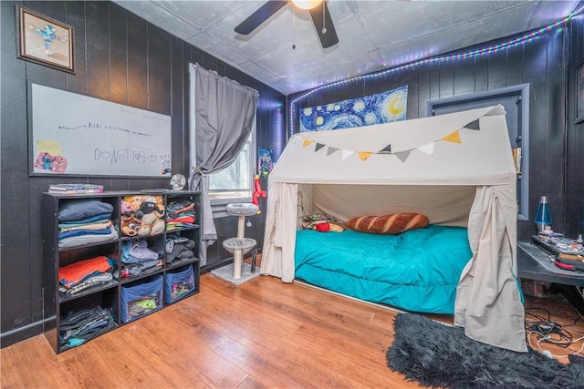 337 Whitestown Rd, Twp Of But Nw, PA 16001 - bedroom with wood finished floors, a ceiling fan, and wooden walls