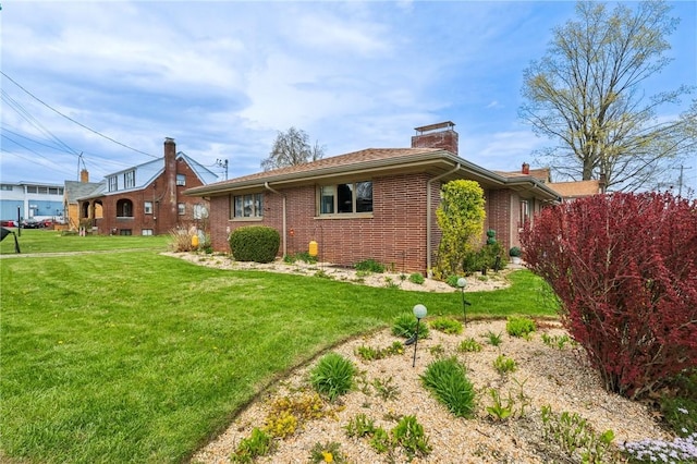 2364 Sheffield Rd, Aliquippa, PA 15001 - view of property exterior featuring a lawn, a chimney, and brick siding