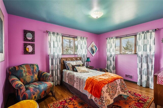 2364 Sheffield Rd, Aliquippa, PA 15001 - bedroom featuring wood finished floors, visible vents, and multiple windows