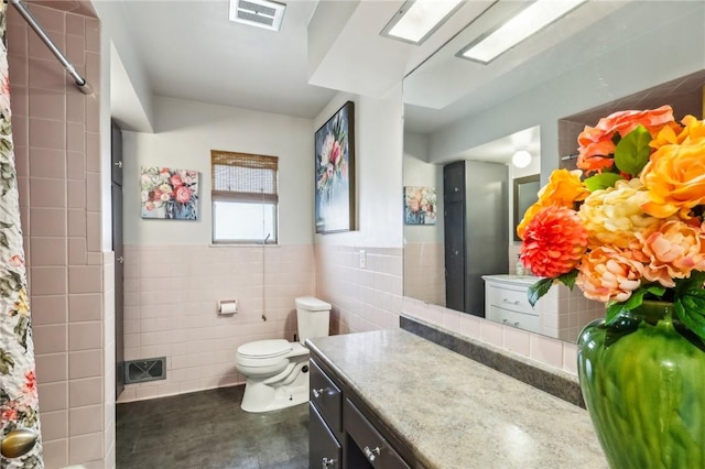 2364 Sheffield Rd, Aliquippa, PA 15001 - full bathroom with a shower with curtain, tile walls, vanity, toilet, and visible vents