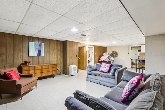 2364 Sheffield Rd, Aliquippa, PA 15001 - living room featuring tile patterned floors, visible vents, wooden walls, and a paneled ceiling