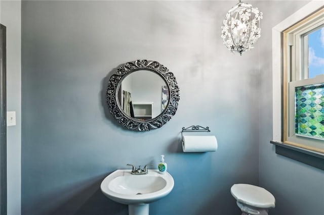 2364 Sheffield Rd, Aliquippa, PA 15001 - bathroom featuring a sink and a chandelier