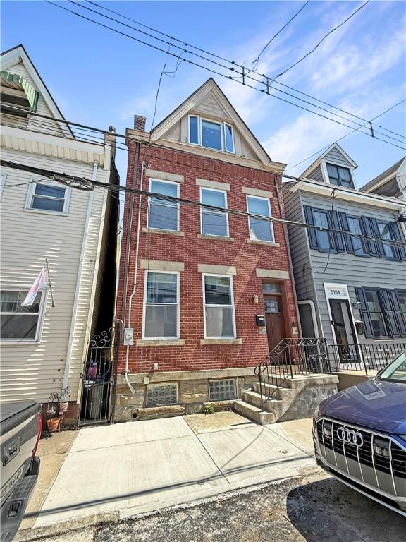 multi unit property featuring brick siding