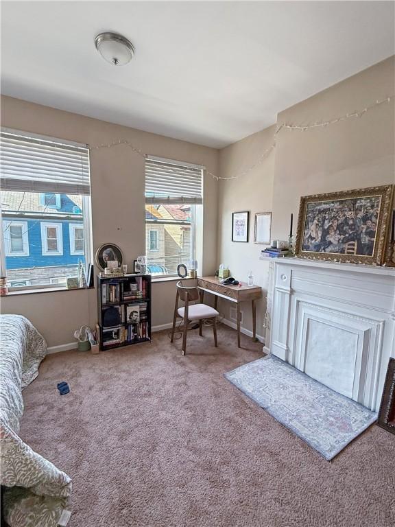 carpeted office featuring a wealth of natural light and baseboards