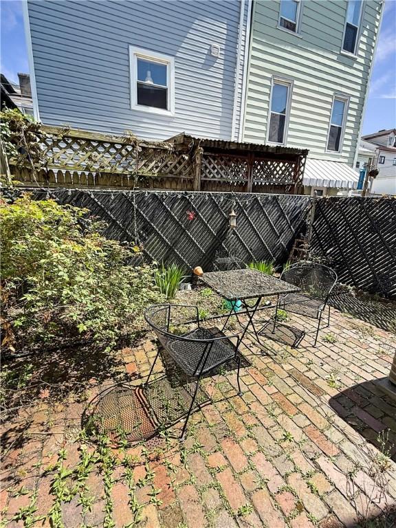 view of patio / terrace featuring outdoor dining space and a fenced backyard