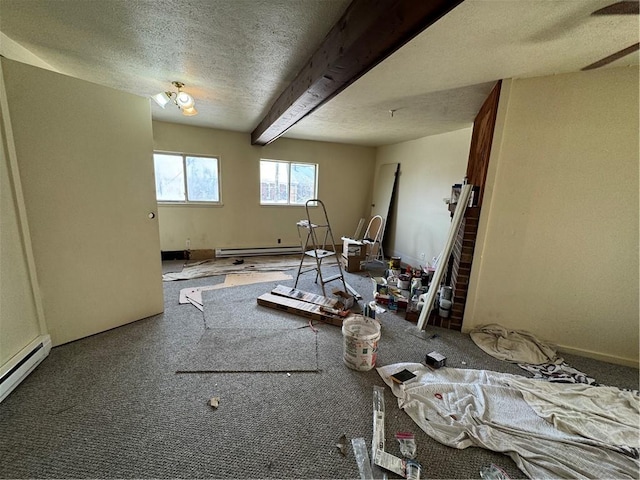 interior space with a textured ceiling, beam ceiling, and a baseboard radiator