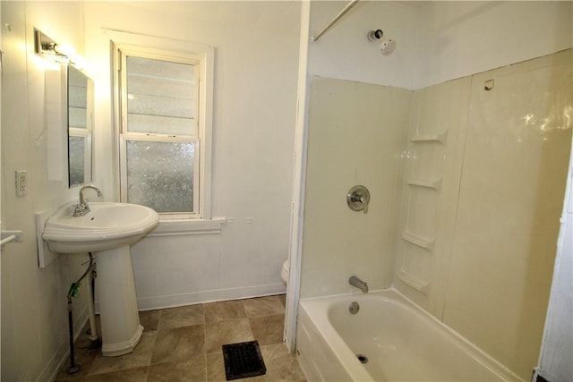 bathroom with toilet, shower / bath combination, a sink, baseboards, and visible vents
