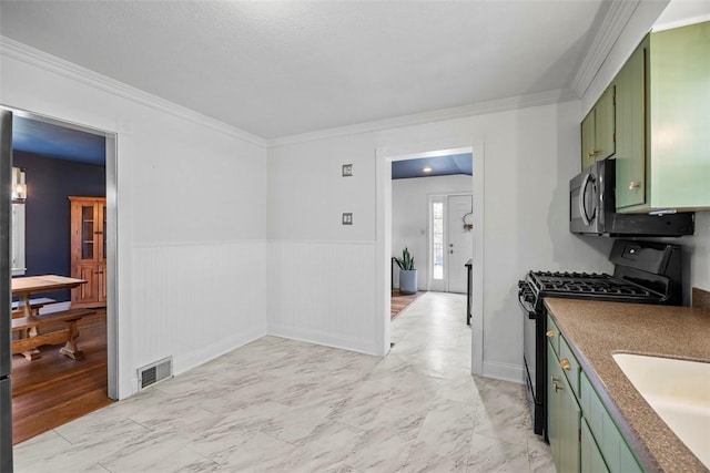 464 Crescent Blvd, Moon/Crescent Twp, PA 15046 - kitchen with green cabinetry, black range with gas cooktop, light marble finish floors, stainless steel microwave, and wainscoting