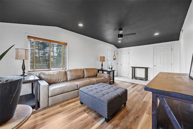 living room featuring lofted ceiling, wood finished floors, ceiling fan, and recessed lighting