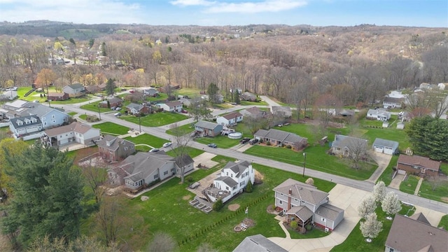 bird's eye view featuring a view of trees and a residential view