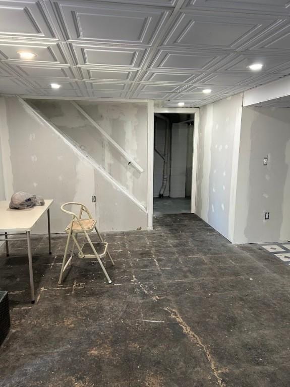 finished below grade area with an ornate ceiling and recessed lighting