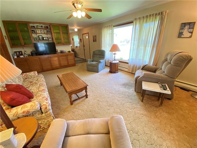living area with light colored carpet, a ceiling fan, baseboard heating, and a baseboard radiator