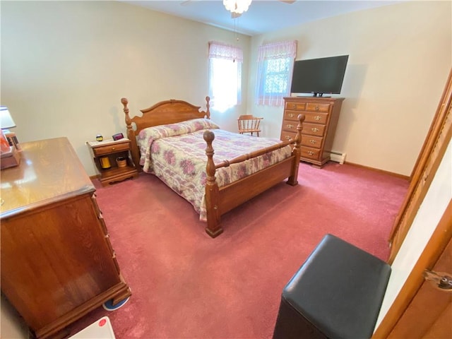 carpeted bedroom featuring baseboards, ceiling fan, and a baseboard radiator