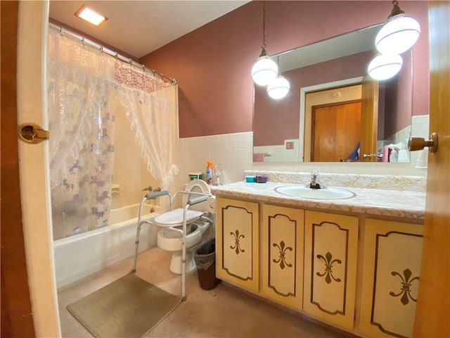 bathroom featuring wainscoting, shower / tub combo, toilet, and vanity