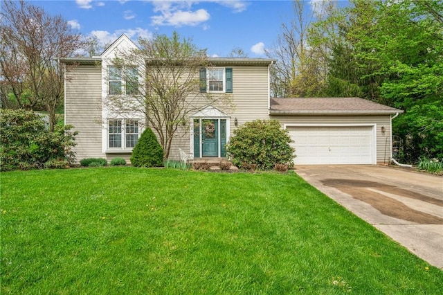 view of front of house with driveway, a front lawn, and a garage