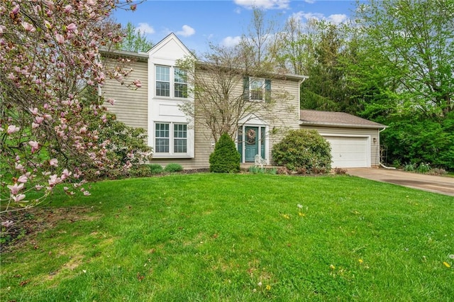 view of front of house with driveway, a front lawn, and a garage