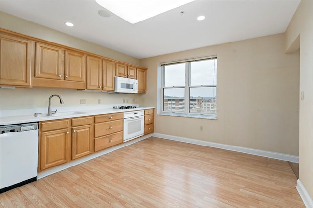 220 N Bellefield Ave Unit 903, Oakland, PA 15213 - kitchen featuring light wood-style floors, white appliances, light countertops, and a sink