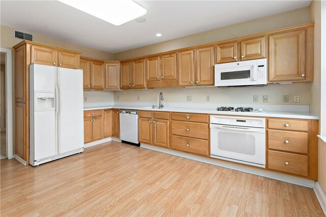 220 N Bellefield Ave Unit 903, Oakland, PA 15213 - kitchen featuring visible vents, white appliances, light wood finished floors, and a sink