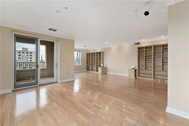 220 N Bellefield Ave Unit 903, Oakland, PA 15213 - spare room with crown molding, light wood finished floors, visible vents, and baseboards