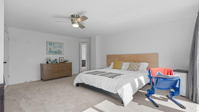 bedroom with a ceiling fan and carpet floors