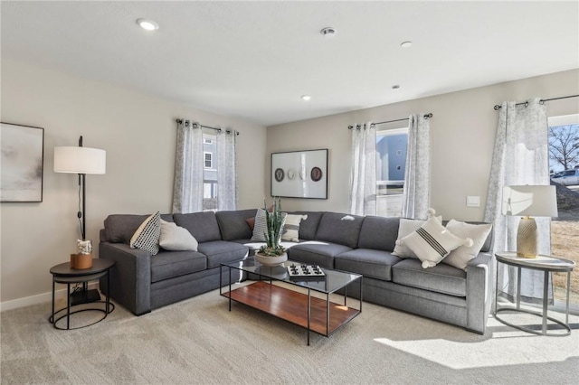 living area featuring carpet, recessed lighting, and baseboards