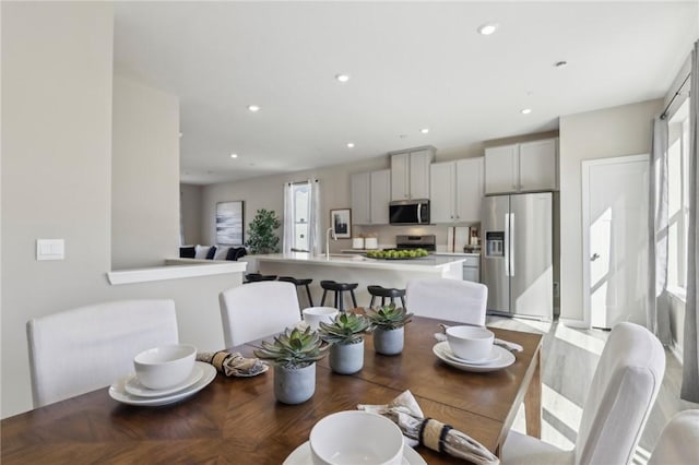 dining room with recessed lighting and a healthy amount of sunlight
