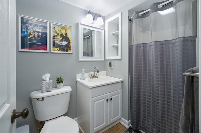 full bathroom featuring toilet, vanity, and a shower with shower curtain