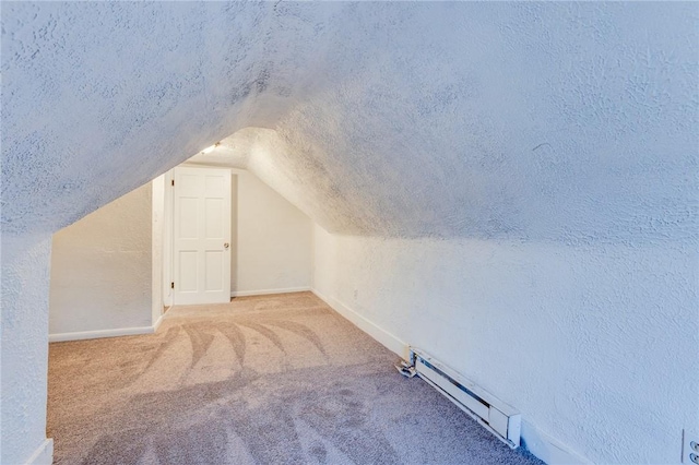 bonus room with vaulted ceiling, carpet, baseboard heating, and baseboards