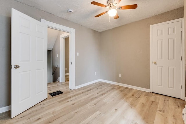 1226 Woodland Ave, Marshall Shadeland, PA 15212 - empty room featuring a ceiling fan, light wood finished floors, baseboards, a smoke detector, and a textured ceiling