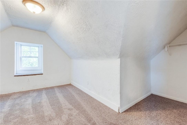 1226 Woodland Ave, Marshall Shadeland, PA 15212 - additional living space with carpet floors, lofted ceiling, and a textured ceiling