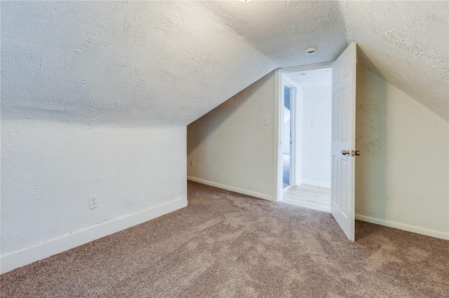 1226 Woodland Ave, Marshall Shadeland, PA 15212 - bonus room with a textured ceiling, carpet, vaulted ceiling, and baseboards
