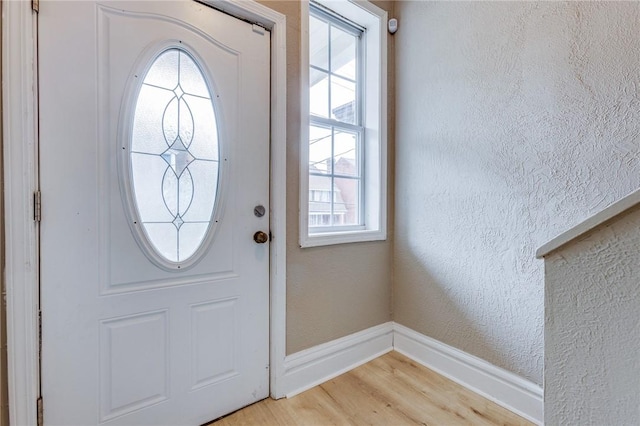 1226 Woodland Ave, Marshall Shadeland, PA 15212 - entryway featuring baseboards, light wood-style floors, and a textured wall