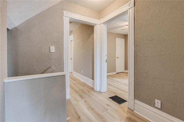 1226 Woodland Ave, Marshall Shadeland, PA 15212 - corridor featuring a textured wall, wood finished floors, and baseboards