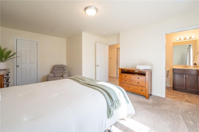 726 Crimson St, Derry Twp, PA 15650 - bedroom with baseboards, ensuite bathroom, light colored carpet, and a sink