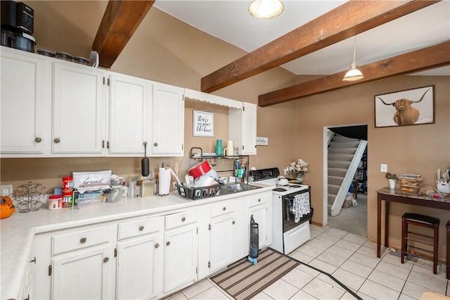 934 W W Rdg, Sharpsville, PA 16150 - kitchen with white electric range oven, beam ceiling, white cabinets, light countertops, and light tile patterned floors