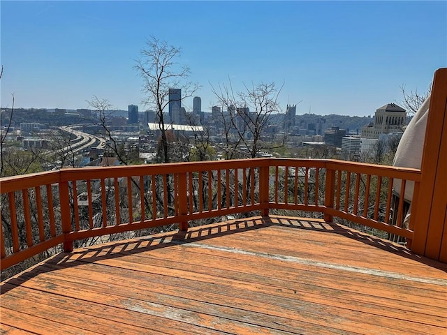 wooden terrace with a view of city