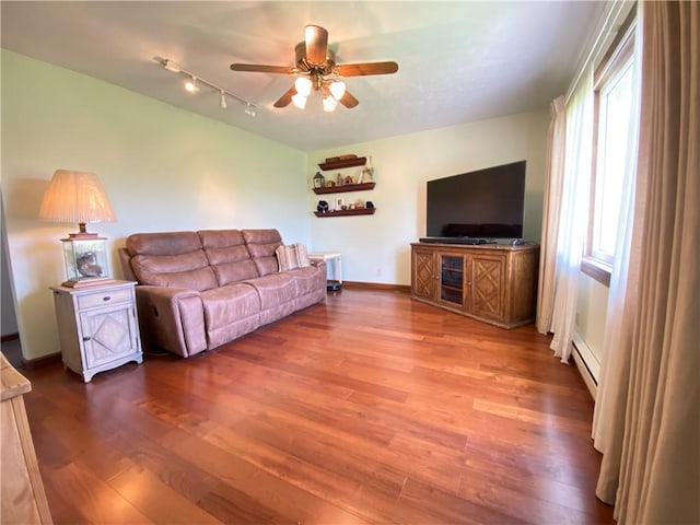 240 Hamburg Rd, Hempfield Twp Mer, PA 16125 - living room with ceiling fan, wood finished floors, track lighting, baseboards, and a baseboard heating unit